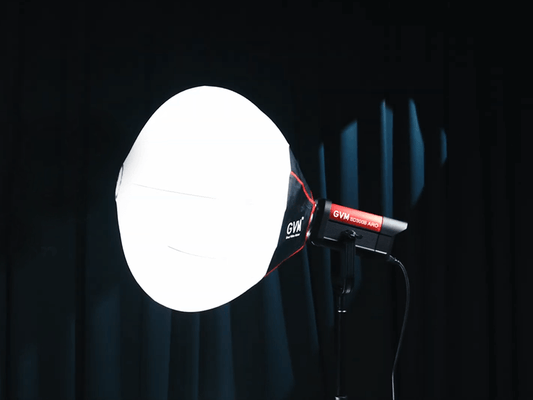 Professional GVM LED Monolight with a lantern softbox modifier, providing 360-degree soft lighting for high-end studio cinematography and video recording.
