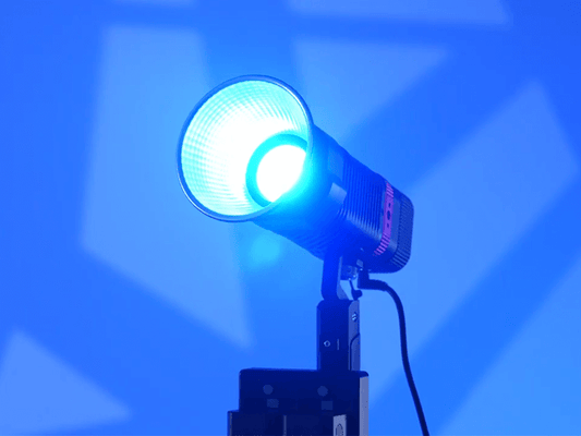 A content creator's hand adjusting the onboard settings of a GVM-PL60C light for video to perfect the lighting for youtube videos.